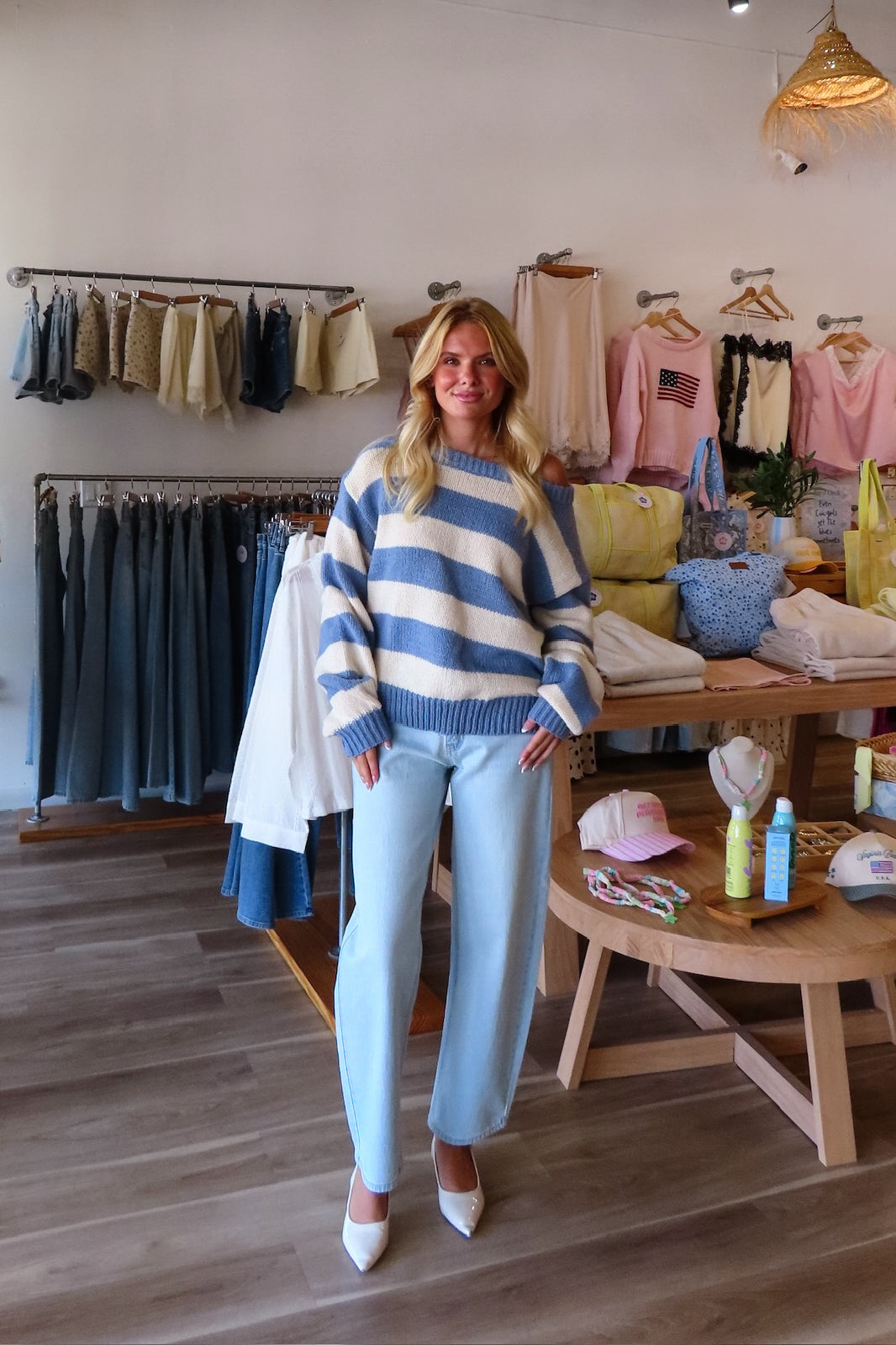 Blue, high-rise jeans with slight barrel leg and pockets