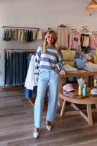 Blue, high-rise jeans with slight barrel leg and pockets