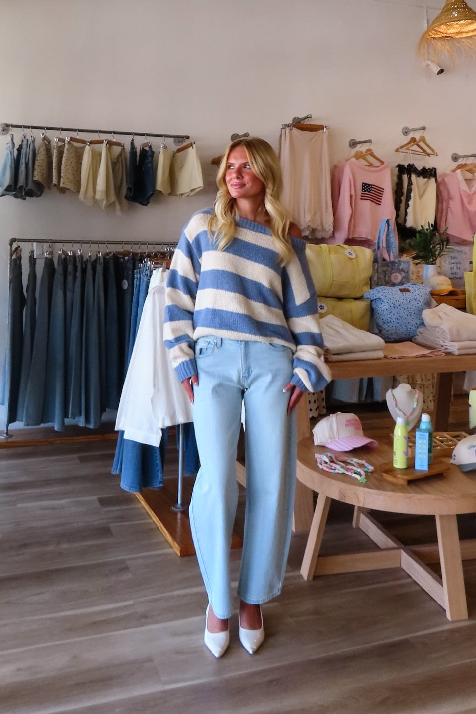 Blue, high-rise jeans with slight barrel leg and pockets