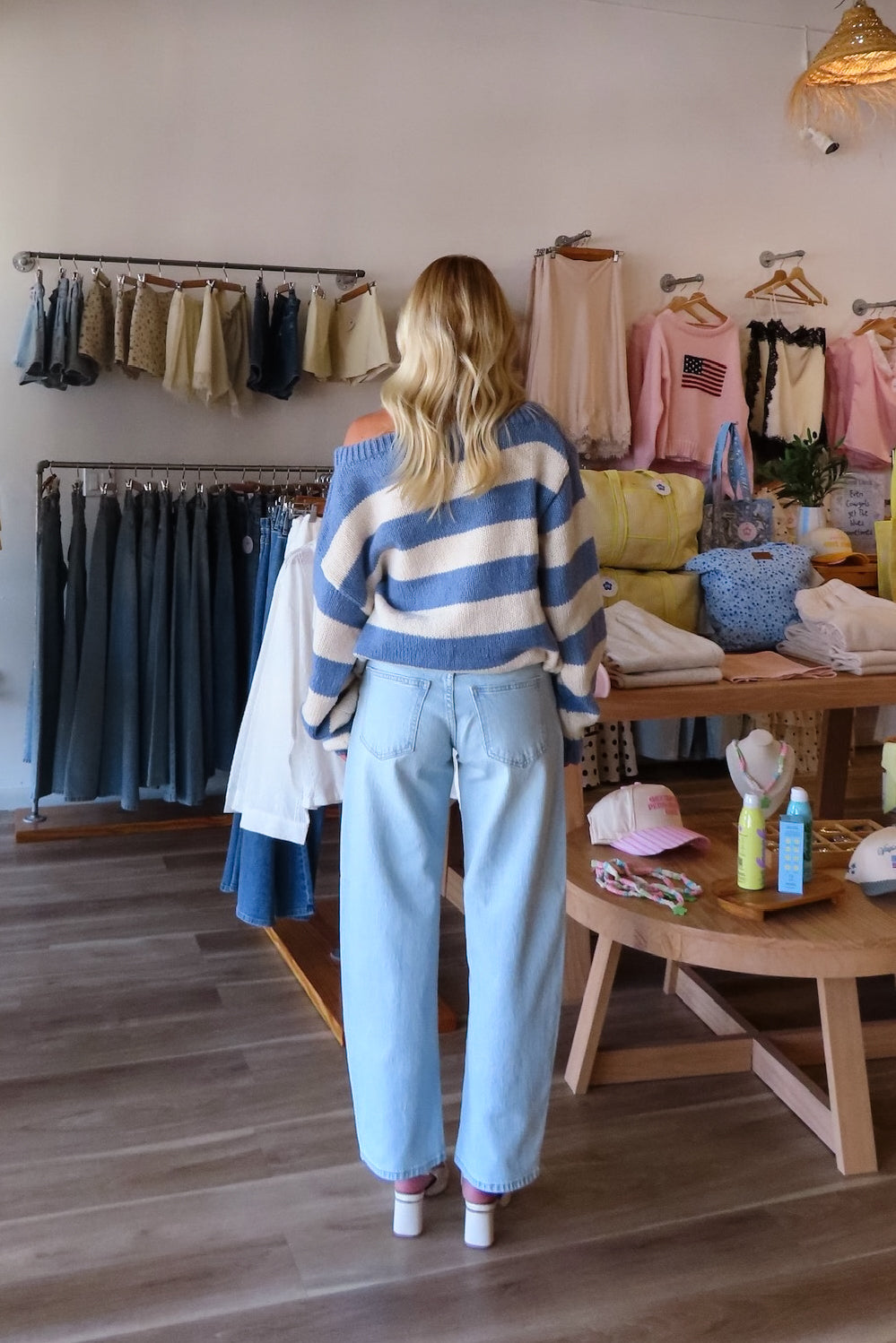 Blue, high-rise jeans with slight barrel leg and pockets