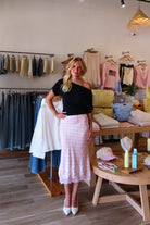 Pink, polka dot satin midi skirt with bias cut, lined interior lace hem, and side zipper