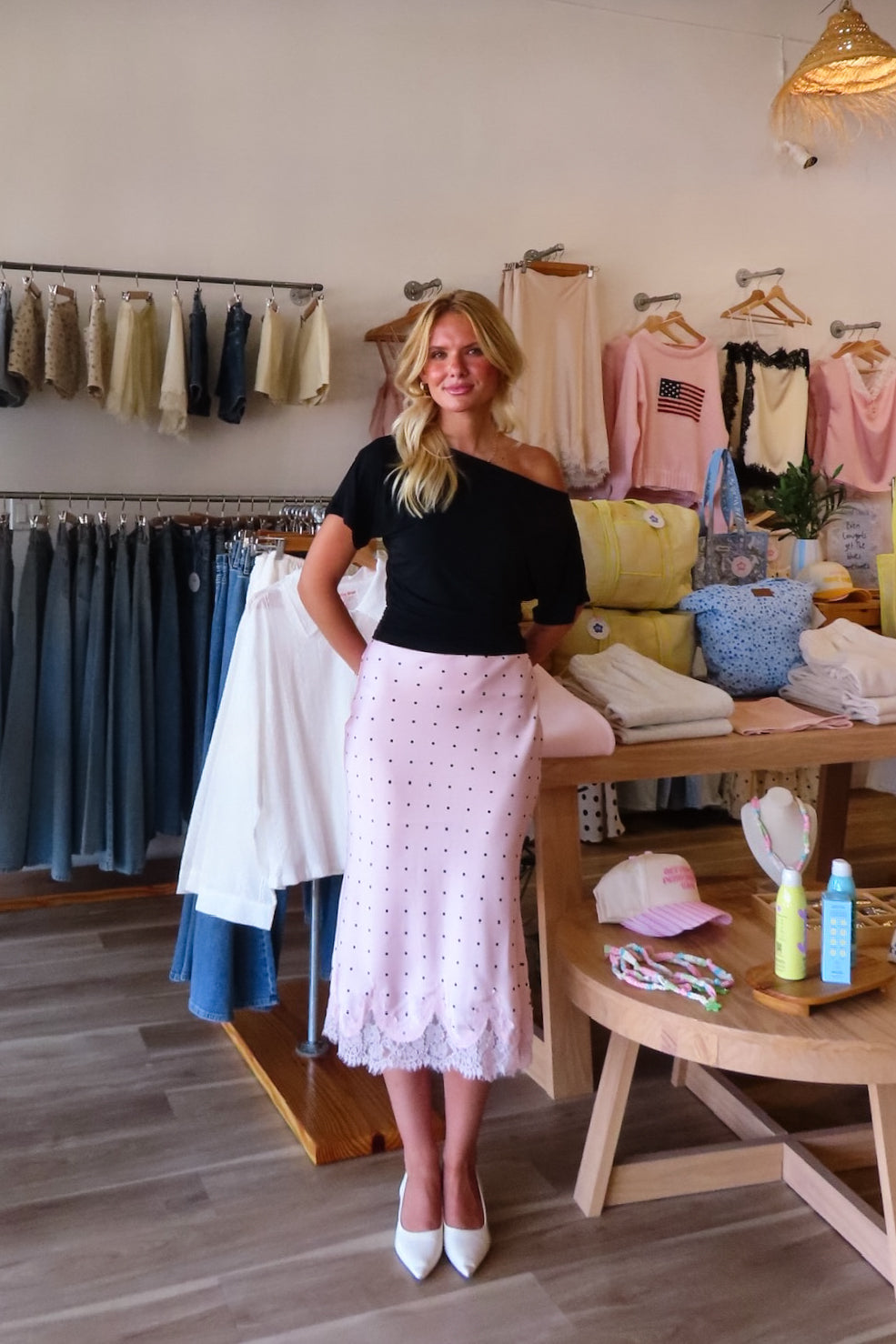 Pink, polka dot satin midi skirt with bias cut, lined interior lace hem, and side zipper