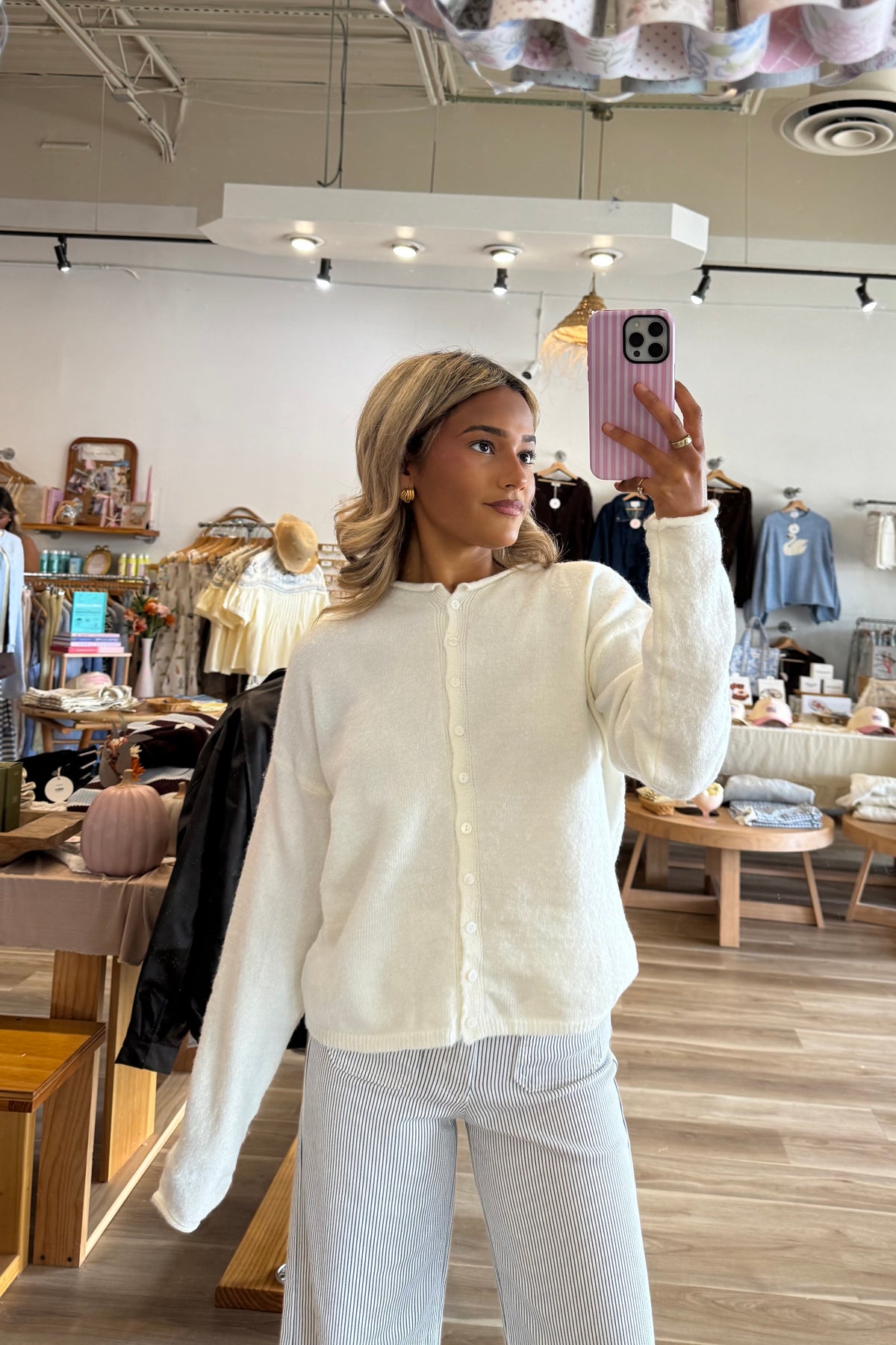 White, rolled collar cardigan with button down, drop shoulder, and ribbed hem