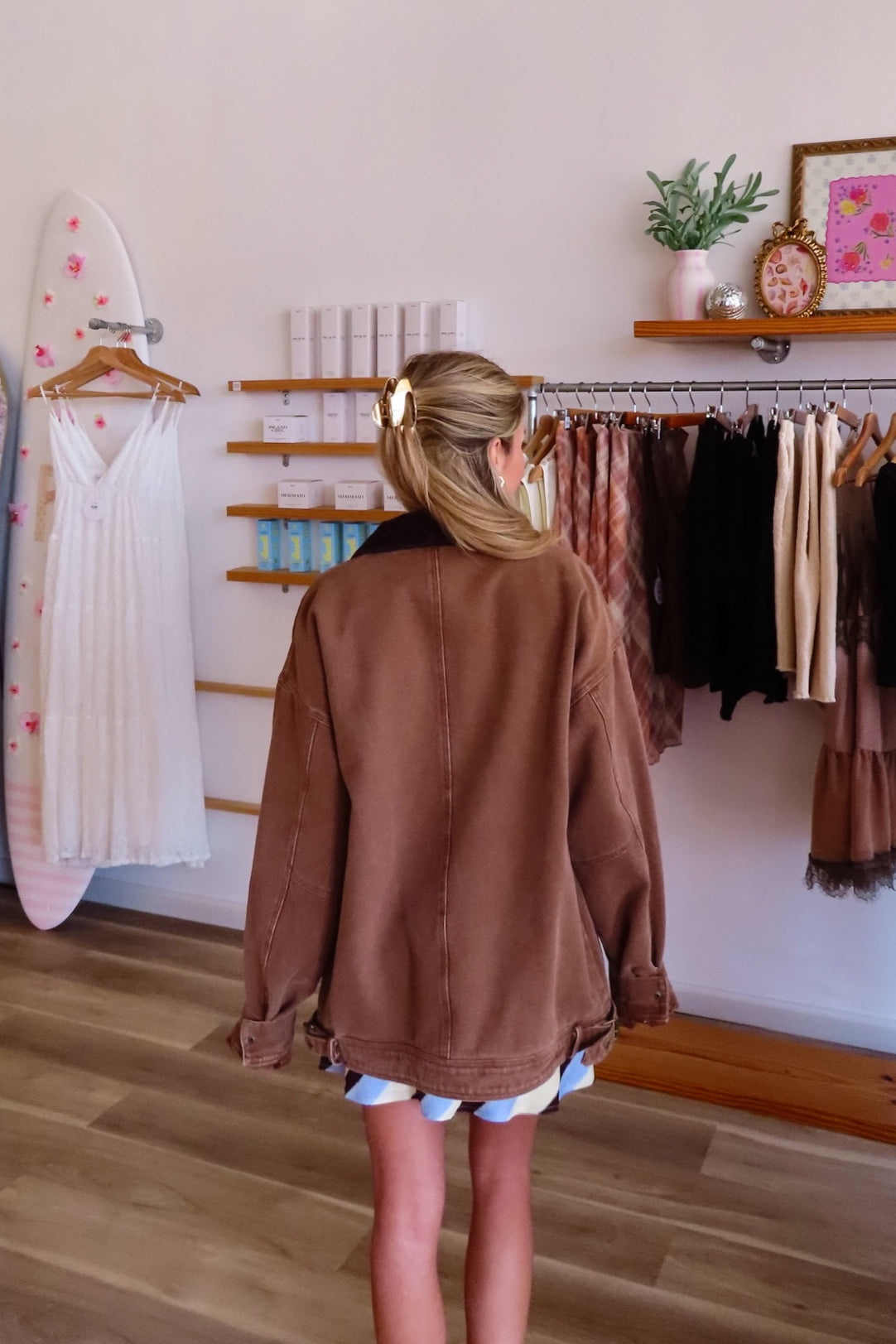 Brown, barn jacket with vintage wash, corduroy collar, side pockets, and hem buckles