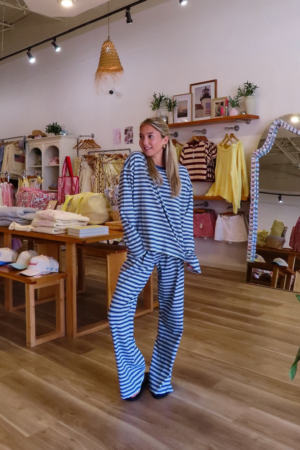Blue, striped knit pants with wide leg, side pockets, and elastic waistband
