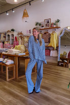 Blue, striped knit pants with wide leg, side pockets, and elastic waistband
