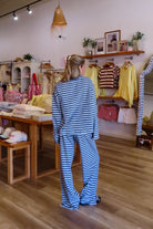 Blue, striped knit pants with wide leg, side pockets, and elastic waistband