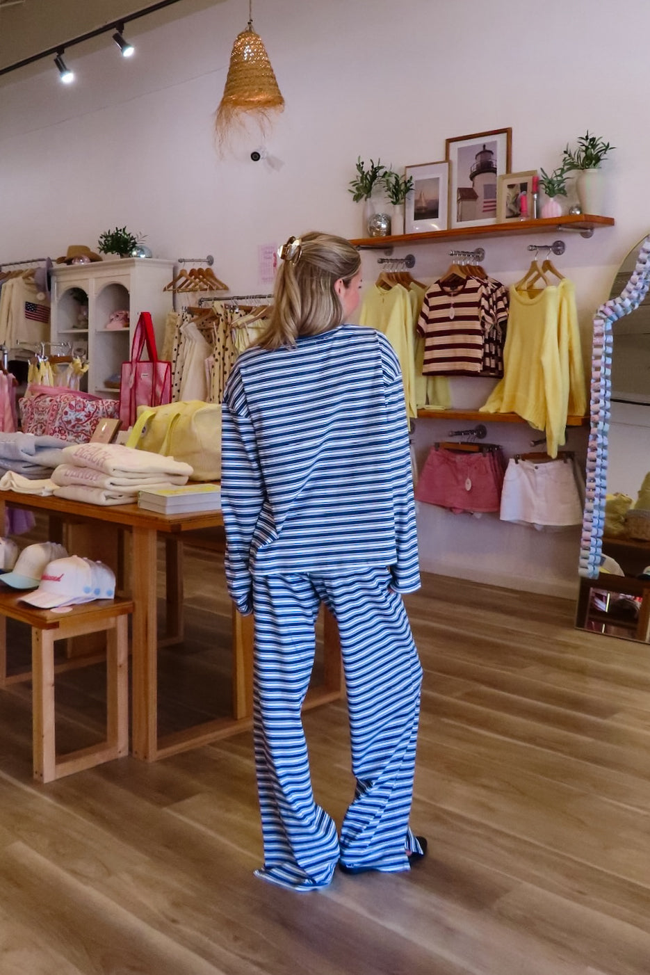 Blue, striped knit pants with wide leg, side pockets, and elastic waistband