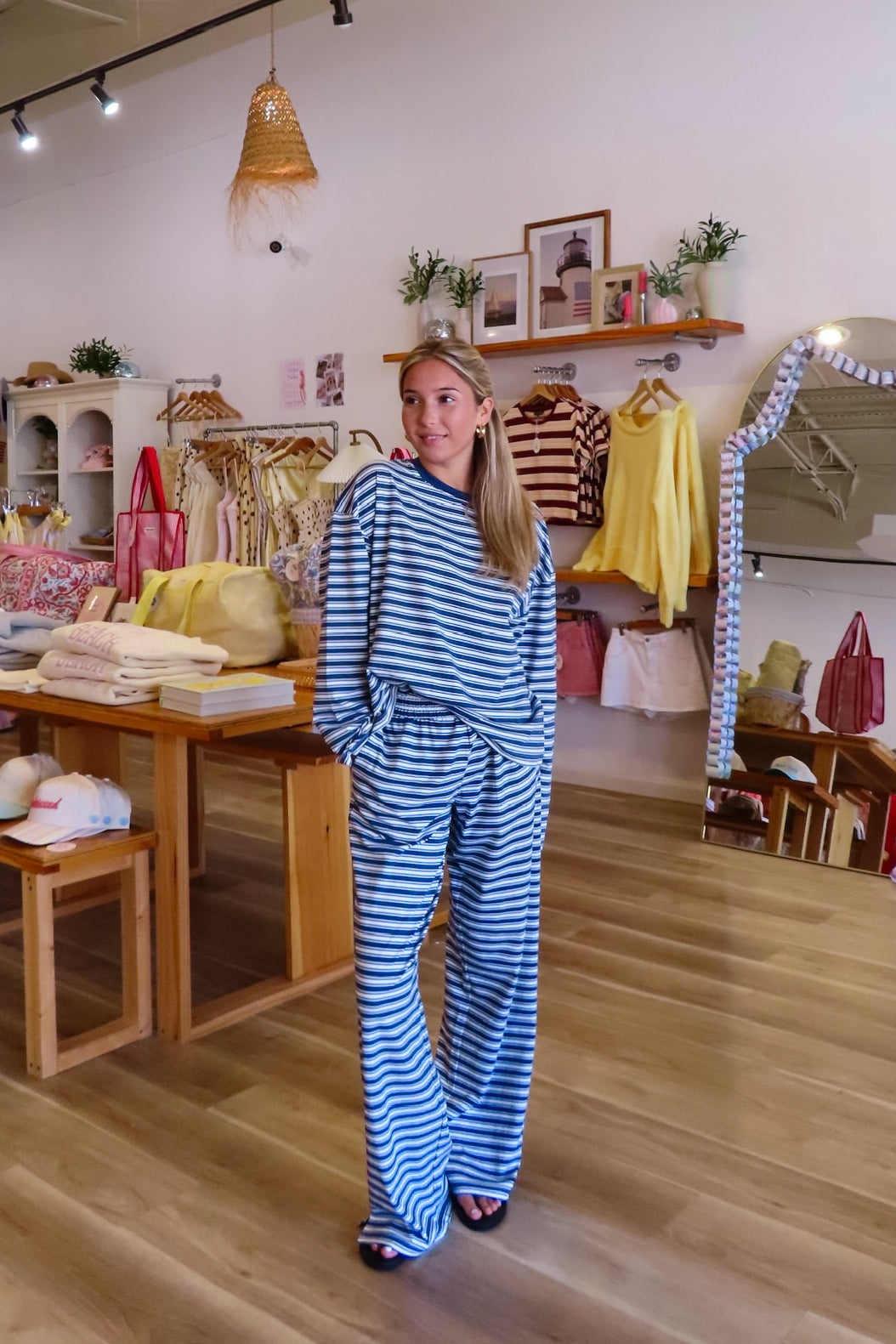 Blue, striped knit pants with wide leg, side pockets, and elastic waistband