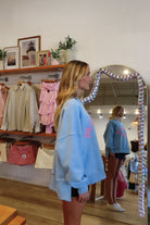 Pixelated Boutique, Women's Clothing, Online Shopping for Women, Fashion Trends 2026, Outfit Inspo, Virginia beach clothing stores, clothing stores in Virginia Beach, fashion outfits, fashion Inspo, women’s outfit 2026, outfit ideas, fashion, spring aesthetic, women’s spring outfit, spring style, spring break, crewneck, mother sweatshirt, Blue crewneck 