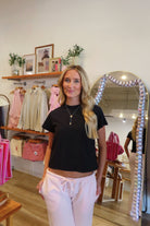 Pixelated Boutique, Women's Clothing, Online Shopping for Women, Fashion Trends 2026, Outfit Inspo, Virginia beach clothing stores, clothing stores in Virginia Beach, fashion outfits, fashion Inspo, women’s outfit 2026, outfit ideas, fashion, spring aesthetic, women’s spring outfit, spring style, spring break, black top, t-shirt, wardrobe staples, neutral style 