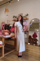 Pixelated Boutique, Women's Clothing, Online Shopping for Women, Fashion Trends 2026, Outfit Inspo, Virginia beach clothing stores, clothing stores in Virginia Beach, fashion outfits, fashion Inspo, women’s outfit 2026, outfit ideas, fashion, spring aesthetic, women’s spring outfit, spring style, spring break, cream dress, high neck dress, satin dress, classy dress