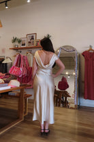 Pixelated Boutique, Women's Clothing, Online Shopping for Women, Fashion Trends 2026, Outfit Inspo, Virginia beach clothing stores, clothing stores in Virginia Beach, fashion outfits, fashion Inspo, women’s outfit 2026, outfit ideas, fashion, spring aesthetic, women’s spring outfit, spring style, spring break, cream dress, high neck dress, satin dress, classy dress