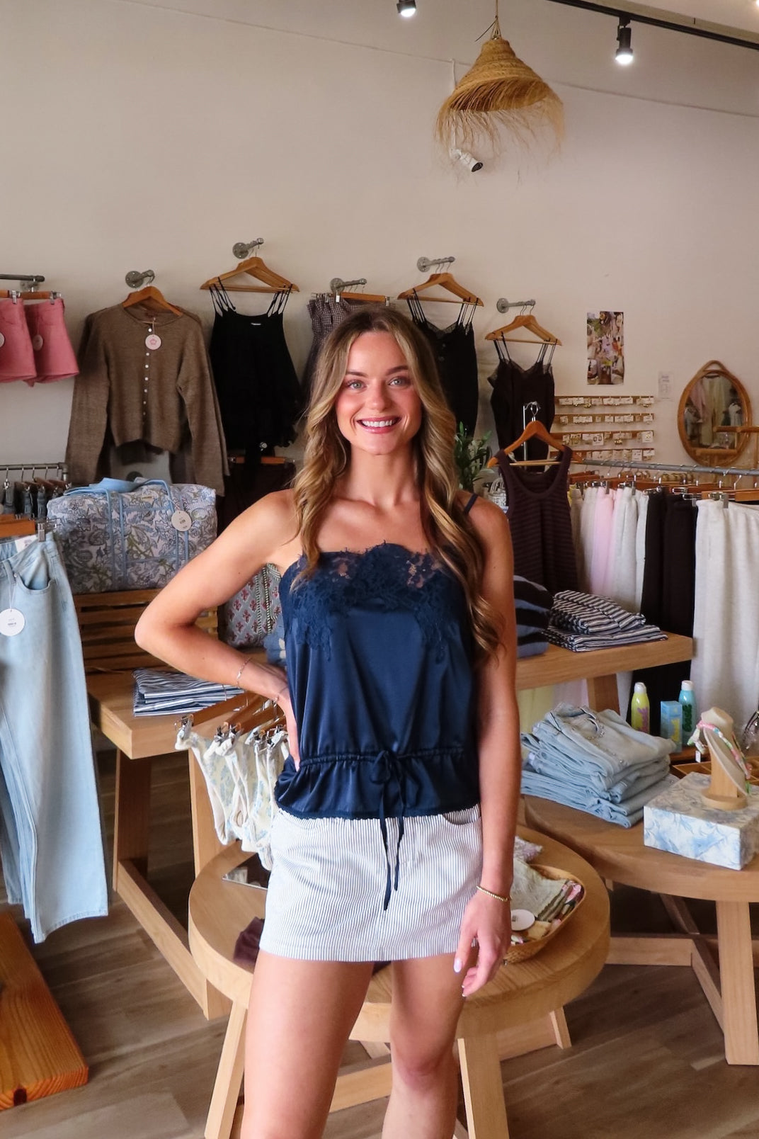 Navy blue, satin cami top with lace trim, waist drawstring tie, and adjustable straps | Pixelated Boutique, Virginia Beach Clothing Stores, Clothing Stores in Virginia Beach, Virginia Beach Boutique, 757 Boutique, Beach Fashion, Vacation Style, Coastal Cowgirl Aesthetic