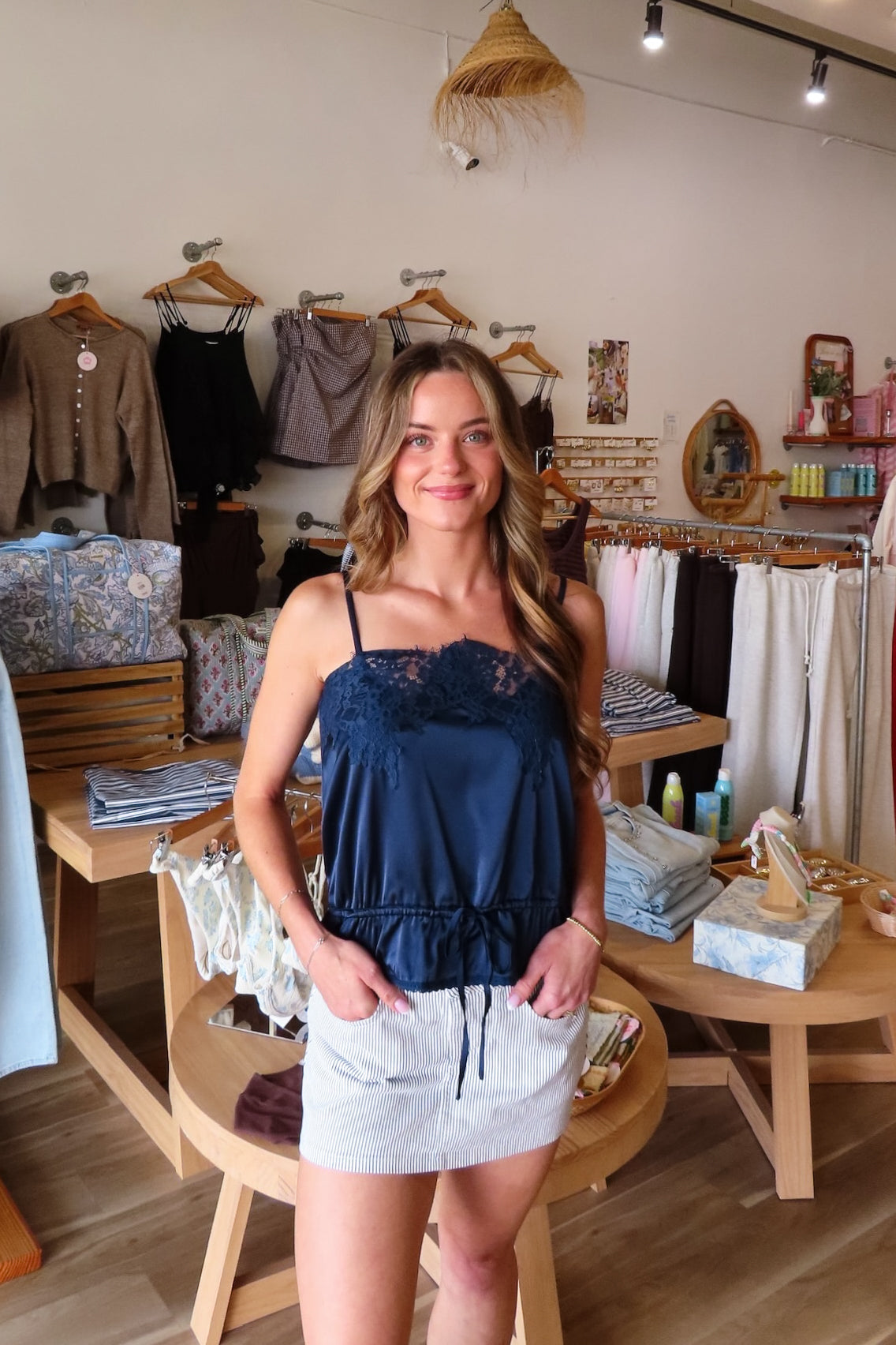 Navy blue, satin cami top with lace trim, waist drawstring tie, and adjustable straps | Pixelated Boutique, Virginia Beach Clothing Stores, Clothing Stores in Virginia Beach, Virginia Beach Boutique, 757 Boutique, Beach Fashion, Vacation Style, Coastal Cowgirl Aesthetic