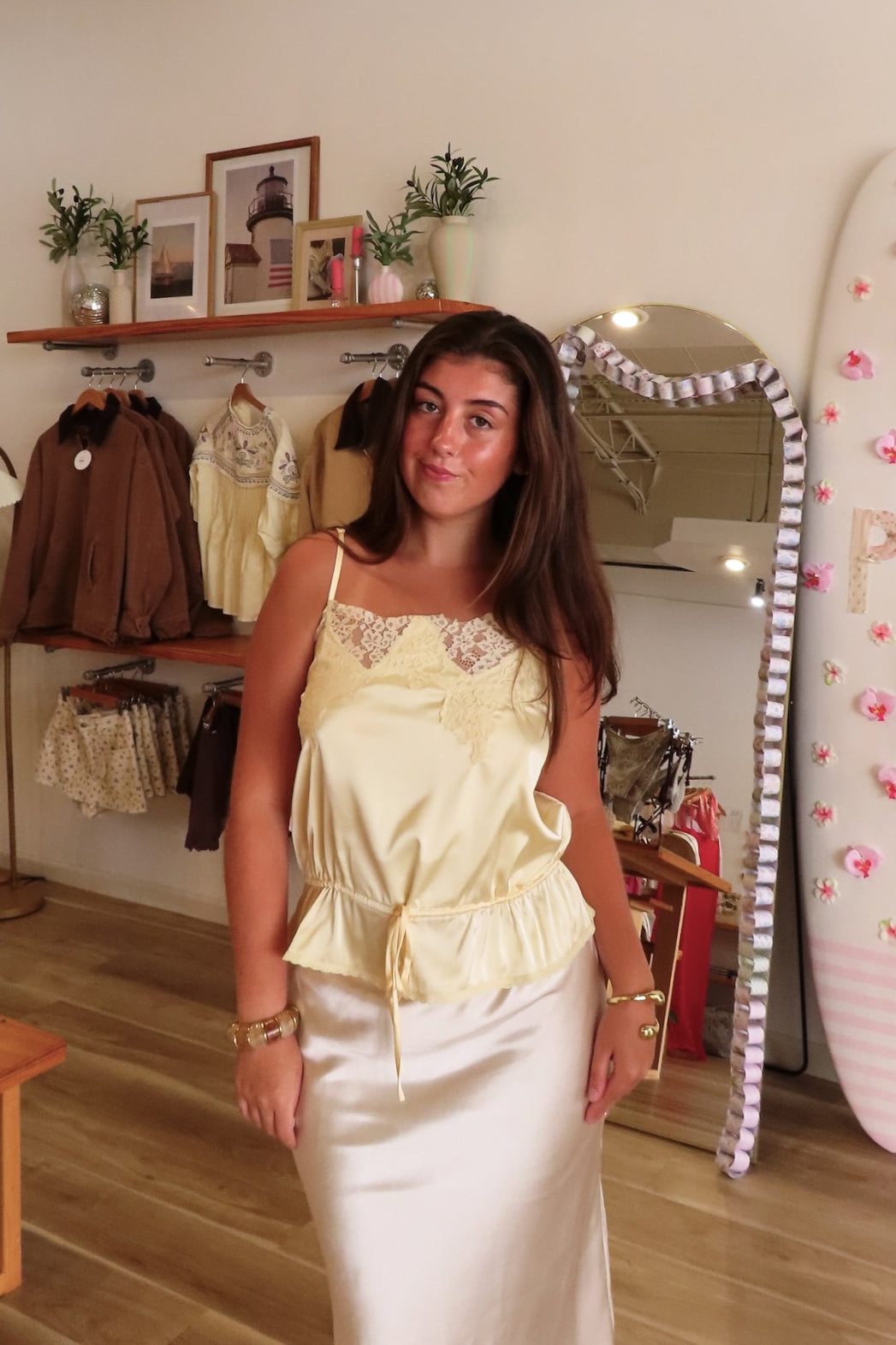 Yellow, satin cami top with lace trim, waist drawstring tie, and adjustable straps | Pixelated Boutique, Online Shopping for Women, Women’s Boutique Clothing, Boutique Clothing for Women, Coastal Aesthetic Clothing, Vacation Outfits, Beach Boutique, Beach Outfits, Business Casual 