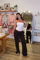 Brown, wide leg sweatpants with low rise waist, drawstring, side pockets, and fleece lining
