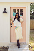 Yellow, satin midi skirt with elastic waist, lace trim, and lining