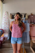 Red, gingham tank top with square neckline, button front, and crossed back straps
Virginia Beach Boutique, 757 Boutique, Online Shopping for Women, summer aesthetic, brunch outfit, vacation style, vacation outfits, beach boutique, beach fashion, beach outfits, women’s boutique clothing, boutique clothing for women, coastal cowgirl outfits, coastal aesthetic clothing, business casual, concert outfit, 2000s fashion, western outfits, july 4th outfit, patriotic top