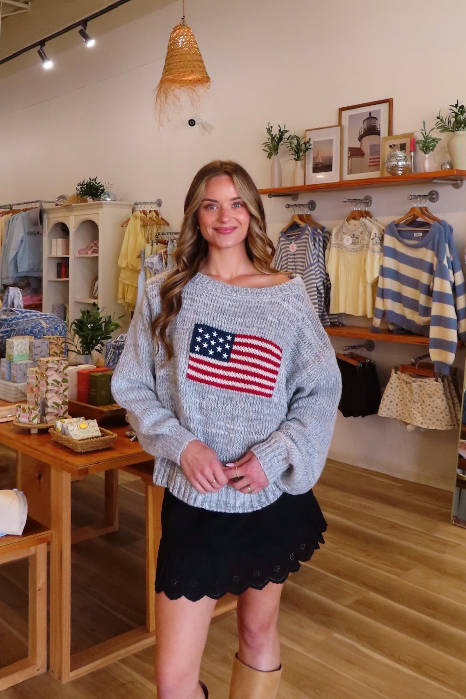 Gray, American flag sweater with boat neckline, ribbed hem, and oversized fit
