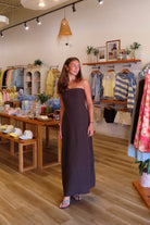 Brown, strapless linen maxi dress with flared hem and smocked back | Pixelated Boutique, Women's Clothing, Boutique Clothing for Women, Women’s Formal Dress, Women’s Occasion Dress, Maxi Dress, Wedding Guest Dress, Prom Dress, Graduation Party Dress 