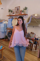Pink, swing cami top with V neckline, asymmetric hem, ruffled chiffon layers, back tie, and adjustable straps