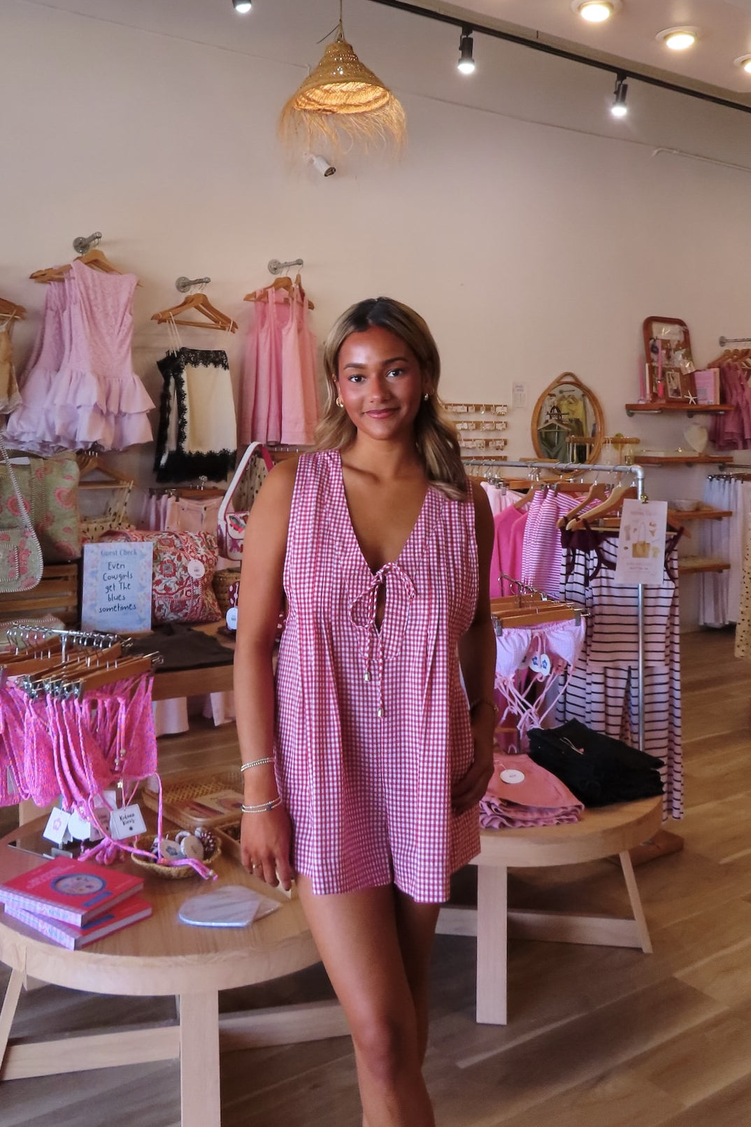 Red, gingham romper with V neckline, front tie, and pleated back