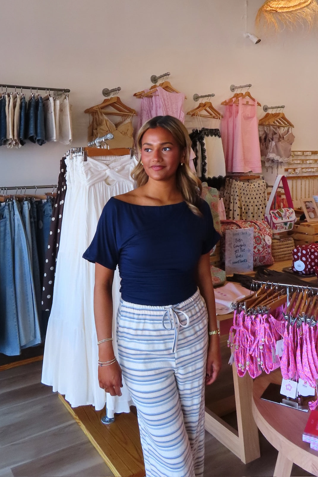 Blue, jersey top with asymmetric off shoulder neckline, ruched waist, and mid-length sleeves