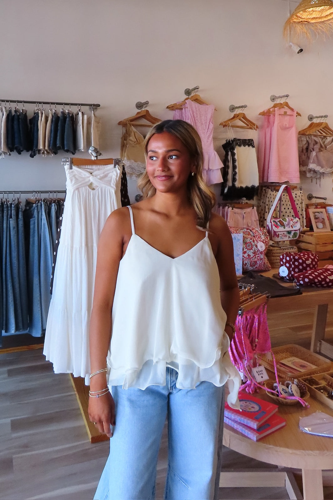 White, swing cami top with V neckline, asymmetric hem, ruffled chiffon layers, back tie, and adjustable straps
Pixelated Boutique, summer aesthetic, brunch outfit, vacation style, vacation outfits, beach boutique, beach fashion, beach outfits, women’s boutique clothing, boutique clothing for women, coastal cowgirl outfits, coastal aesthetic clothing, business casual, concert outfit, 2000s fashion, western outfits