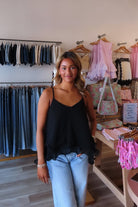 Black, swing cami top with V neckline, asymmetric hem, ruffled chiffon layers, back tie, and adjustable straps
Pixelated Boutique, Women's Clothing, Virginia Beach Clothing Stores, Clothing Stores in Virginia Beach, Virginia Beach Boutique, 757 Boutique, Online Shopping for Women, summer aesthetic, brunch outfit, vacation style, vacation outfits, beach boutique, beach fashion, beach outfits, women’s boutique clothing, boutique clothing for women, coastal cowgirl outfits, coastal aesthetic clothing, business