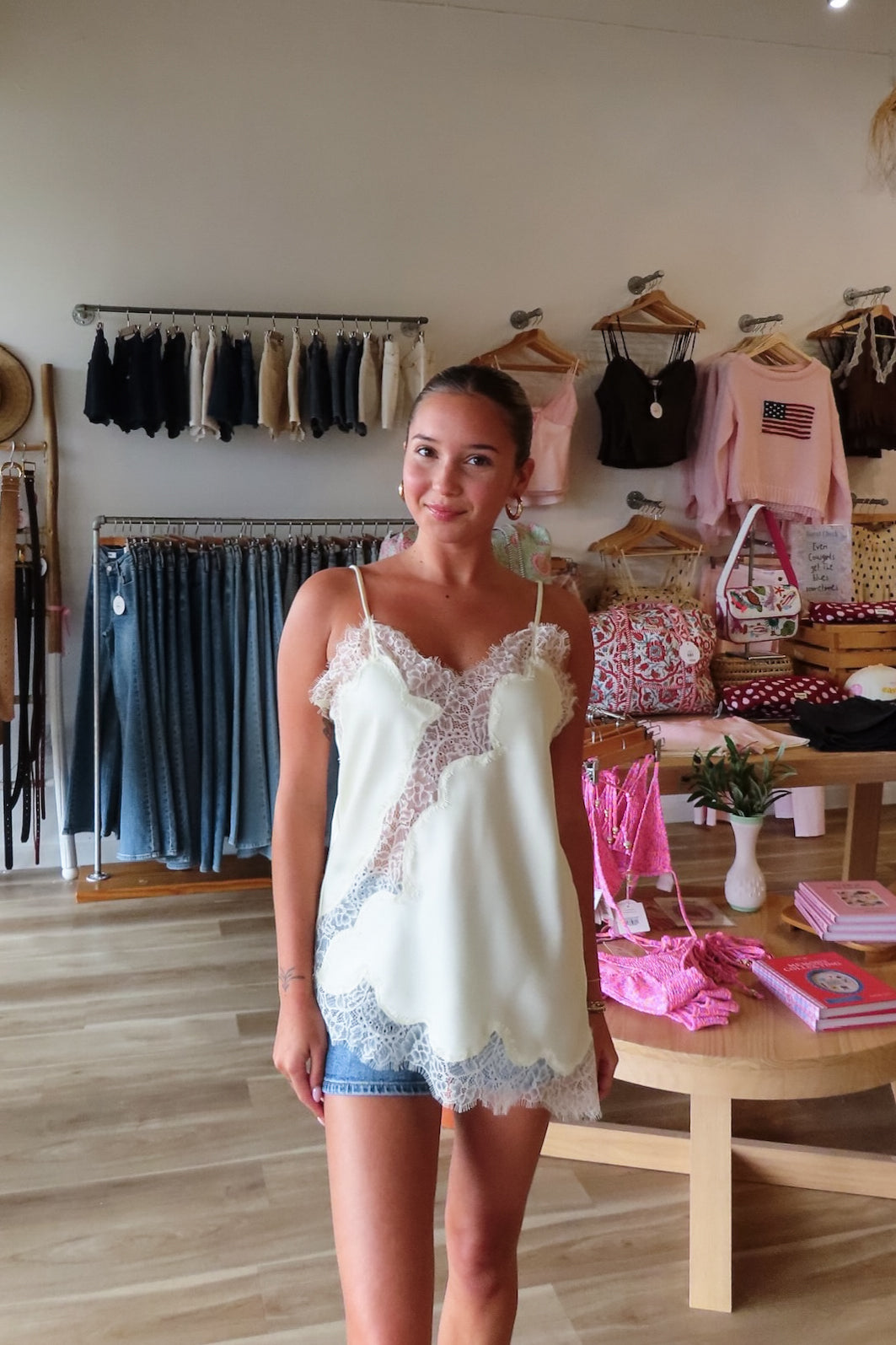 Cream, satin cami top with V neckline, asymmetric hem, scalloped lace trim, and adjustable straps, women’s lace going out top, date night lace top, asymmetrical hem top, girls night out top, vacation dinner outfit top