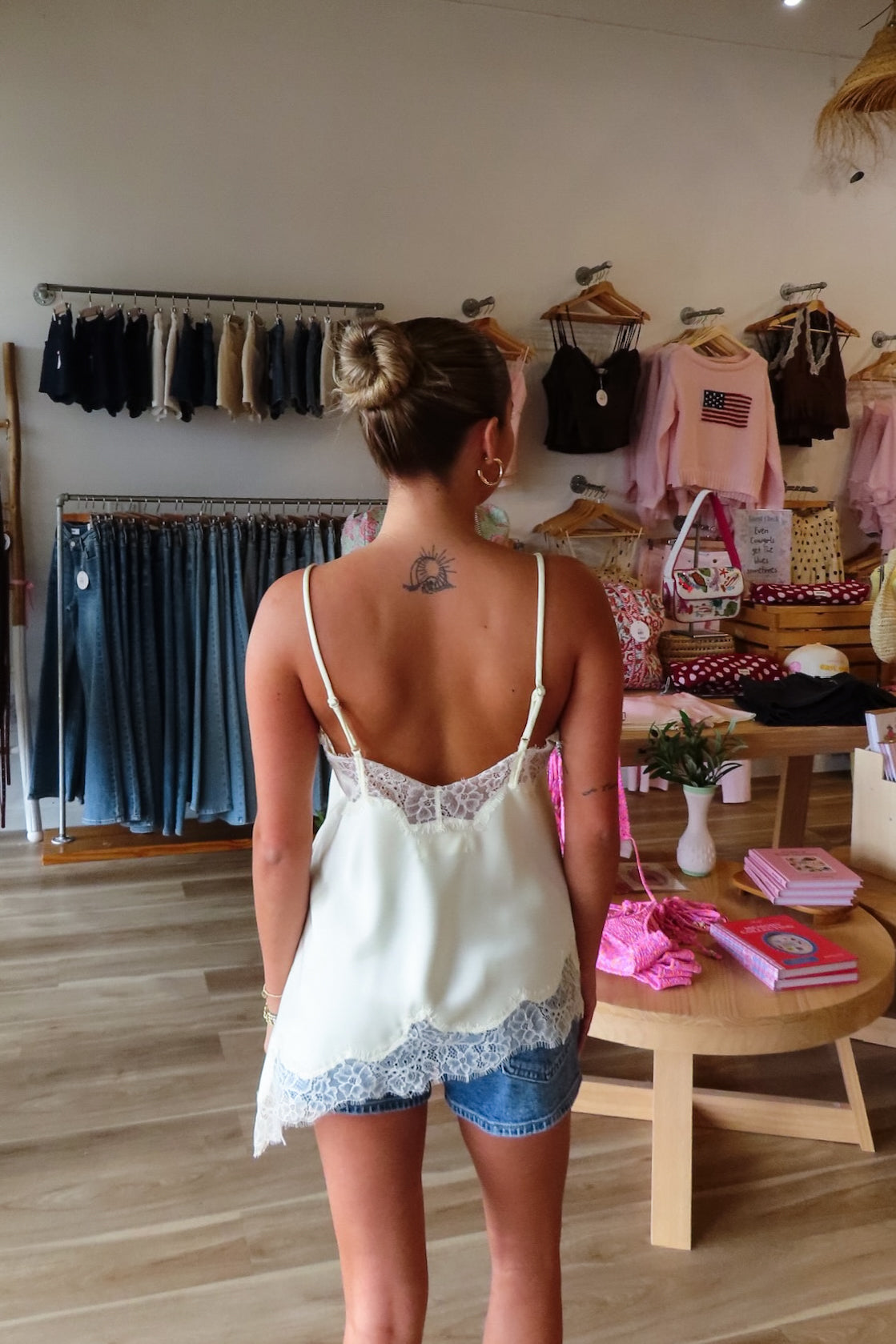 Cream, satin cami top with V neckline, asymmetric hem, scalloped lace trim, and adjustable straps, women’s lace going out top, date night lace top, asymmetrical hem top, girls night out top, vacation dinner outfit top