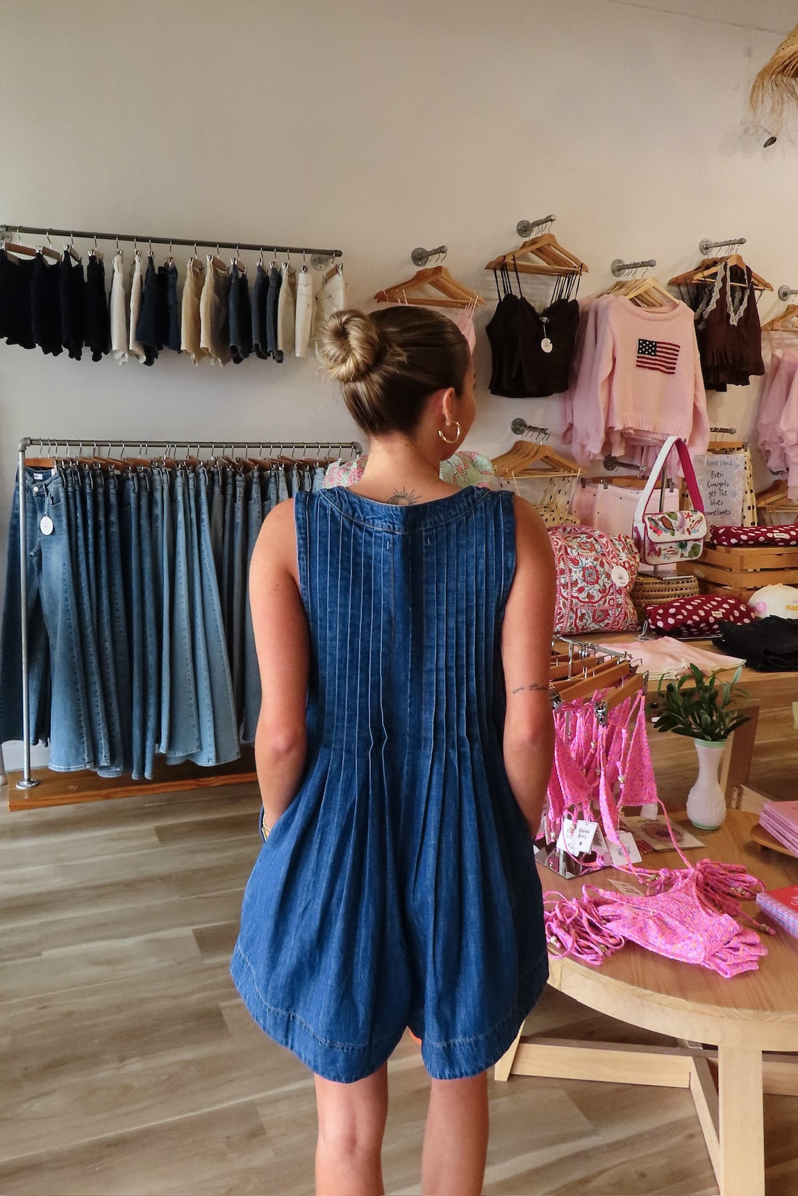 Blue, denim romper with V neckline, front tie, pockets, and pleated back, women’s boutique clothing, boutique clothing for women, coastal cowgirl outfits, coastal aesthetic clothing, business casual, concert outfit, 2000s fashion, western outfits