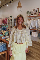Yellow, floral blouse with lace trim and panelling, quarter sleeves, button down, and cropped length, boho blouse, summer aesthetic, brunch outfit, vacation style, vacation outfits, beach boutique, beach fashion, beach outfits, women’s boutique clothing, boutique clothing for women, coastal cowgirl outfits, coastal aesthetic clothing