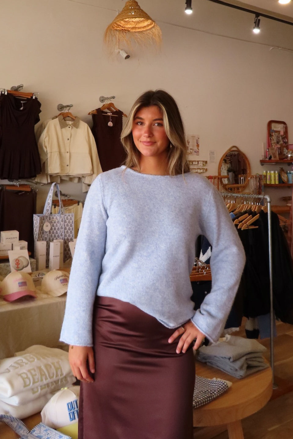 Blue, heathered knit top with round neckline, long sleeves, ruched sides, and raw hem | Pixelated Boutique, Boutique Clothing in Virginia Beach, Statement Sweaters, Chunky Sweaters, Trendy Sweaters, Cozy Knit Sweaters for Women, Oversized Sweaters, Cute Fall Sweaters, Fall Fashion Inspiration  