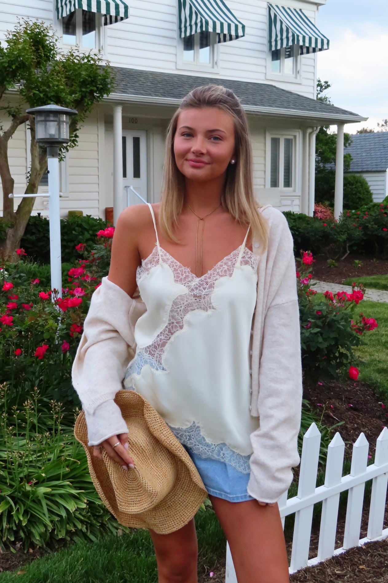 Cream, satin cami top with V neckline, asymmetric hem, scalloped lace trim, and adjustable straps, women’s lace going out top, date night lace top, asymmetrical hem top, girls night out top, vacation dinner outfit top