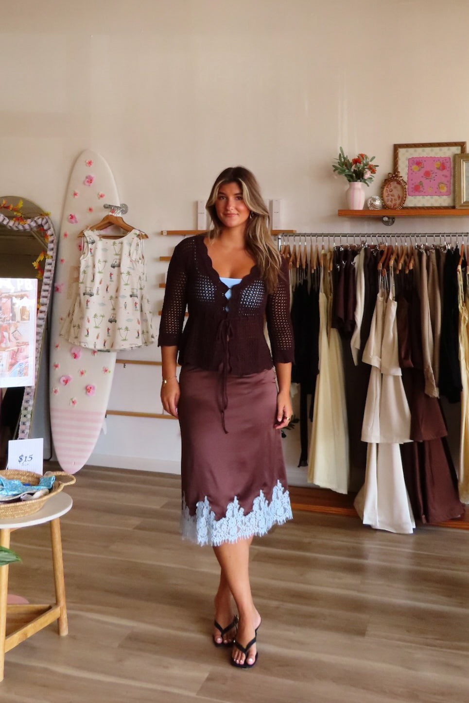 Brown, satin midi skirt with bias cut, contrast lace trim, and side zipper | Pixelated Boutique, Online Shopping for Women, Women’s Boutique Clothing, Boutique Clothing for Women, Coastal Aesthetic Clothing, Vacation Outfits, Beach Boutique, Beach Outfits, Business Casual 
