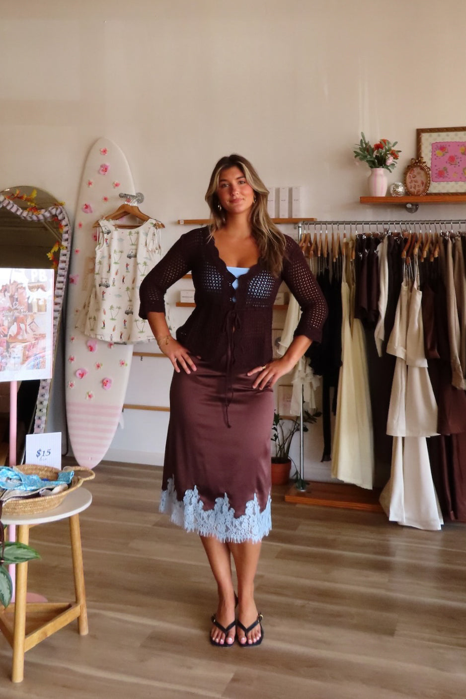 Brown, satin midi skirt with bias cut, contrast lace trim, and side zipper | Pixelated Boutique, Online Shopping for Women, Women’s Boutique Clothing, Boutique Clothing for Women, Coastal Aesthetic Clothing, Vacation Outfits, Beach Boutique, Beach Outfits, Business Casual 
