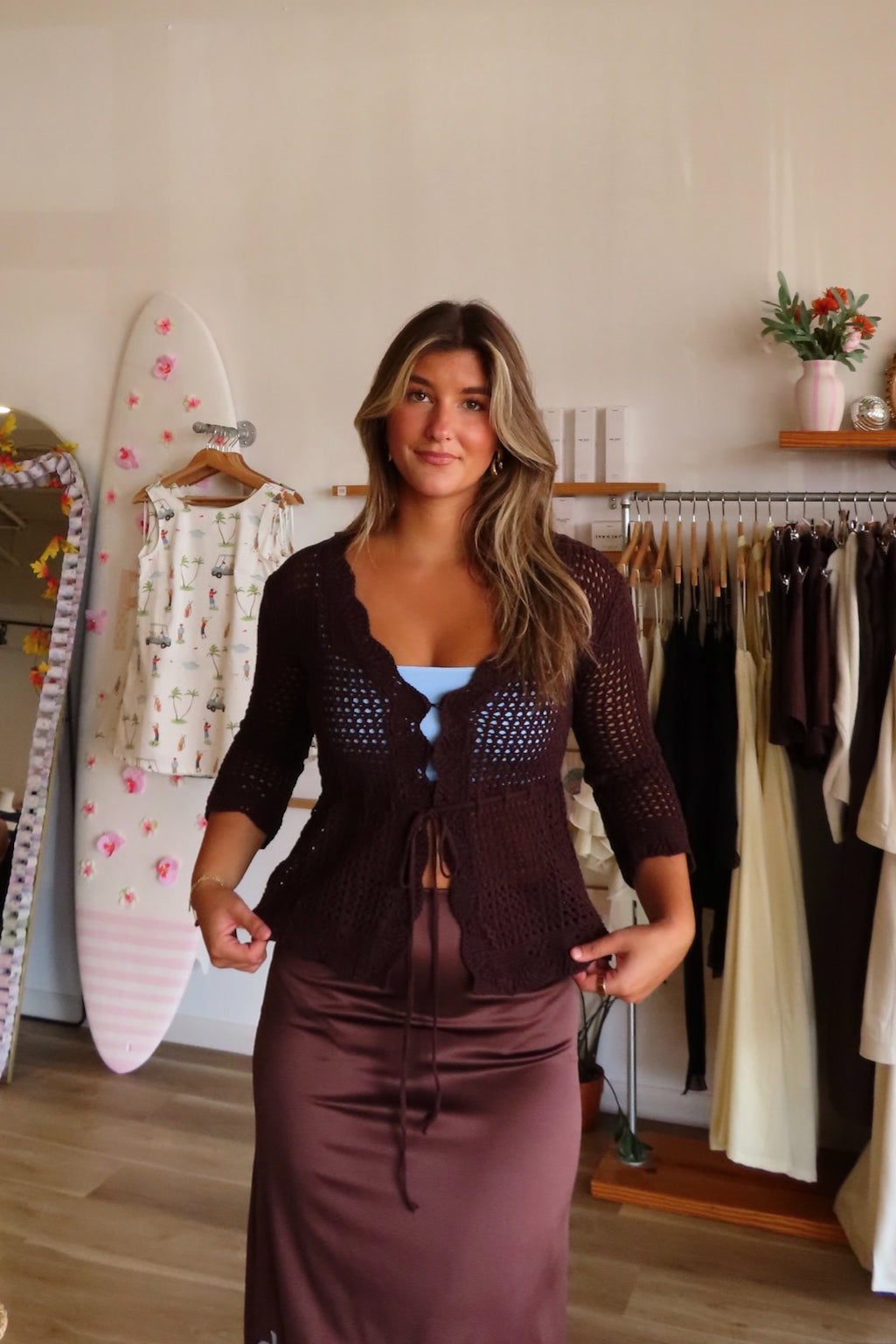 Brown, crochet cardigan with V neckline, tie front, scallop trim, three quarter sleeves, peplum waist, and ruffle hem | Pixelated Boutique, Virginia Beach Clothing Stores, Clothing Stores in Virginia Beach, Virginia Beach Boutique, 757 Boutique, Beach Fashion, Vacation Style, Coastal Cowgirl Aesthetic