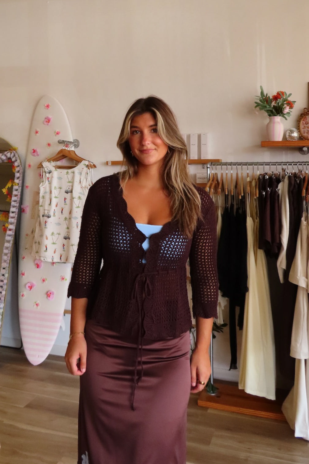 Brown, crochet cardigan with V neckline, tie front, scallop trim, three quarter sleeves, peplum waist, and ruffle hem | Pixelated Boutique, Virginia Beach Clothing Stores, Clothing Stores in Virginia Beach, Virginia Beach Boutique, 757 Boutique, Beach Fashion, Vacation Style, Coastal Cowgirl Aesthetic