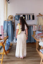 Cream, satin jacquard midi skirt with bias cut, lace trim, front bow, and side zipper, lace midi skirt, eyelet lace maxi skirt, summer maxi skirt, lace midi skirt for summer, bridal outfits, graduation dress, lace skirt for summer, beach fashion, coastal cowgirl aesthetic, beach girl outfits