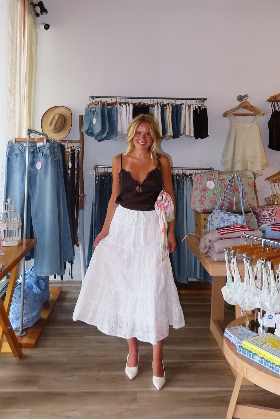White, eyelet maxi skirt with ruffled tiers, elastic waistband, and drawstring