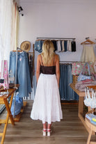 White, eyelet maxi skirt with ruffled tiers, elastic waistband, and drawstring, lace midi skirt, eyelet lace maxi skirt, summer maxi skirt, lace midi skirt for summer, bridal outfits, graduation dress, lace skirt for summer, beach fashion, coastal cowgirl aesthetic, beach girl outfits
