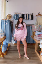 Pink, satin shorts with mid rise, lace hem, and elastic waist, Satin lace trim shorts for summer, women’s satin shorts, silky lace shorts, coquette satin shorts with lace trim, soft girl loungewear, romantic lace hem satin shorts for summer, summer aesthetic fashion, vacation style, vacation outfits, beach fashion, trendy summer shorts