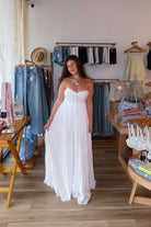 White, strapless maxi dress with sweetheart neckline, ruched bust with knot, and asymmetric ruffled hem
Virginia Beach Boutique, 757 Boutique, fashion, summer aesthetic, women’s trendy summer outfit, spring break, vacation style, vacation outfits, beach boutique, beach fashion, beach outfits, coastal aesthetic clothing, maxi dress, formal dress, wedding guest dress, satin slip dress, prom dress, graduation party dress