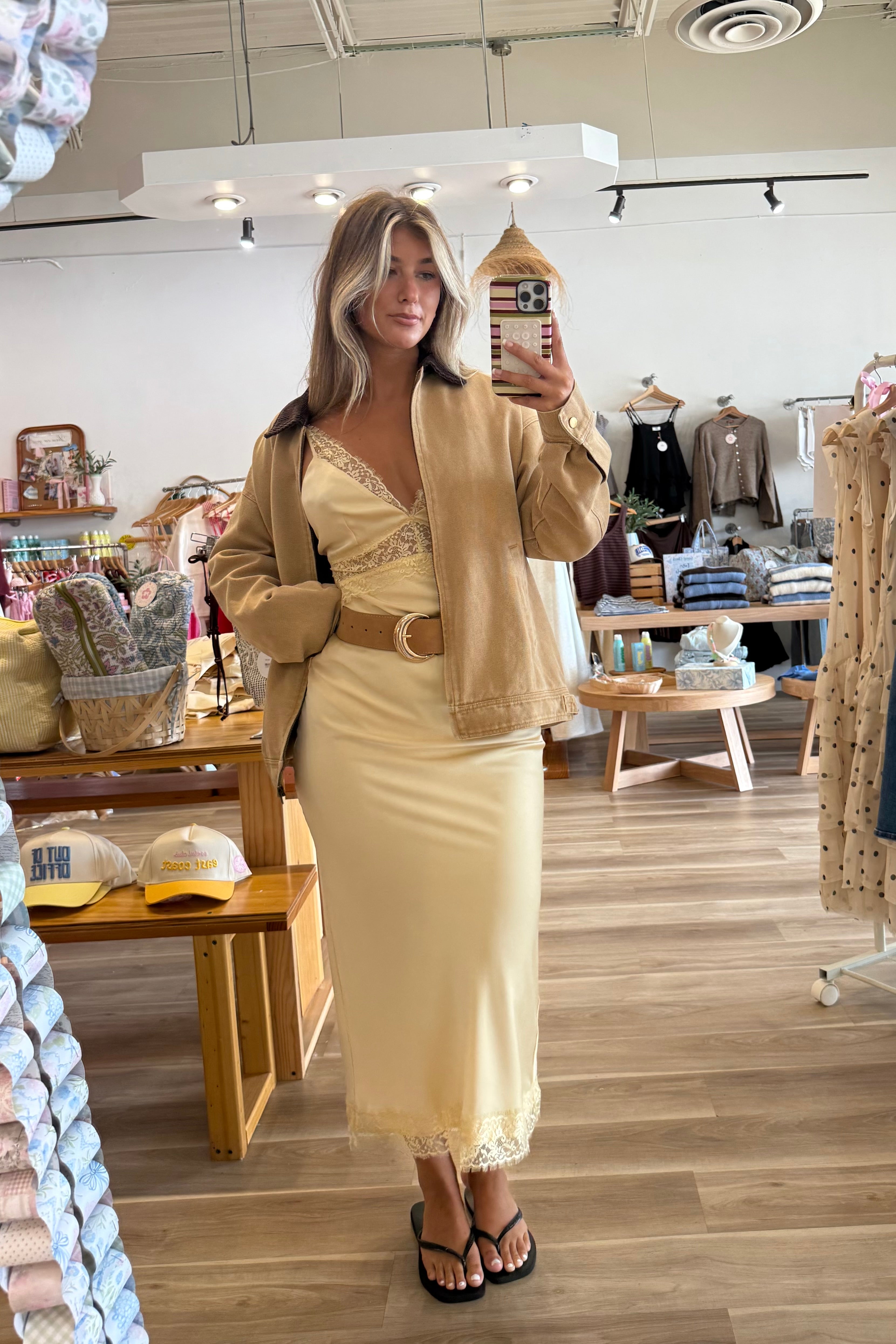 Yellow, satin maxi dress with V neckline, lace trim, open back, and adjustable cross straps