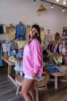Pink, embroidered sweatshirt with mock neckline and oversized fit. By Sunkissed Coconut | Pixelated Boutique,  Virginia Beach Boutique, 757 Boutique, Online Shopping for Women, Oversized Sunkissed Sweatshirt, Mock Neck Sweatshirt, Summer Sweatshirt