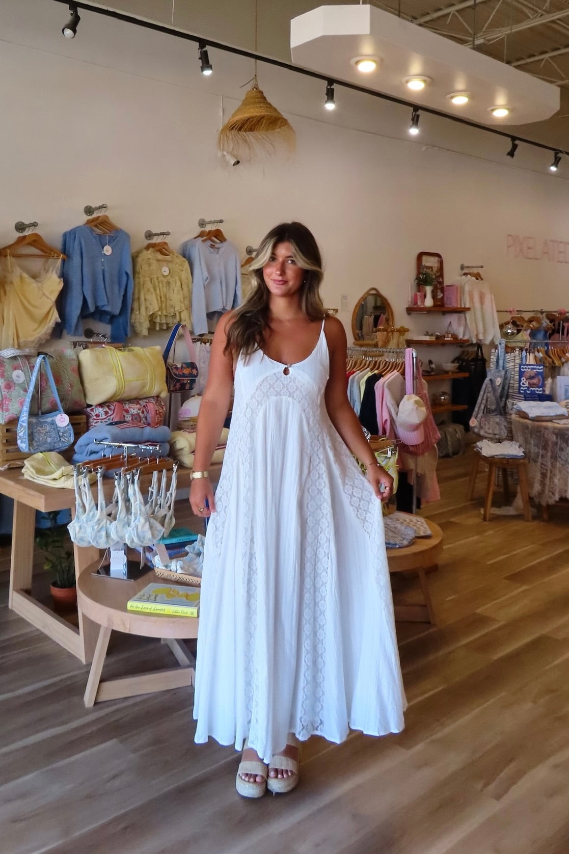 White, textured lace maxi dress with V neckline, front keyhole button, and adjustable open back, white maxi dress, white lace dress, boho maxi dress, bridal shower dress, bachelorette dress, graduation dress
