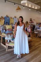 White, textured lace maxi dress with V neckline, front keyhole button, and adjustable open back, white maxi dress, white lace dress, boho maxi dress, bridal shower dress, bachelorette dress, graduation dress
