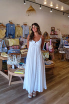 White, textured lace maxi dress with V neckline, front keyhole button, and adjustable open back, white maxi dress, white lace dress, boho maxi dress, bridal shower dress, bachelorette dress, graduation dress
